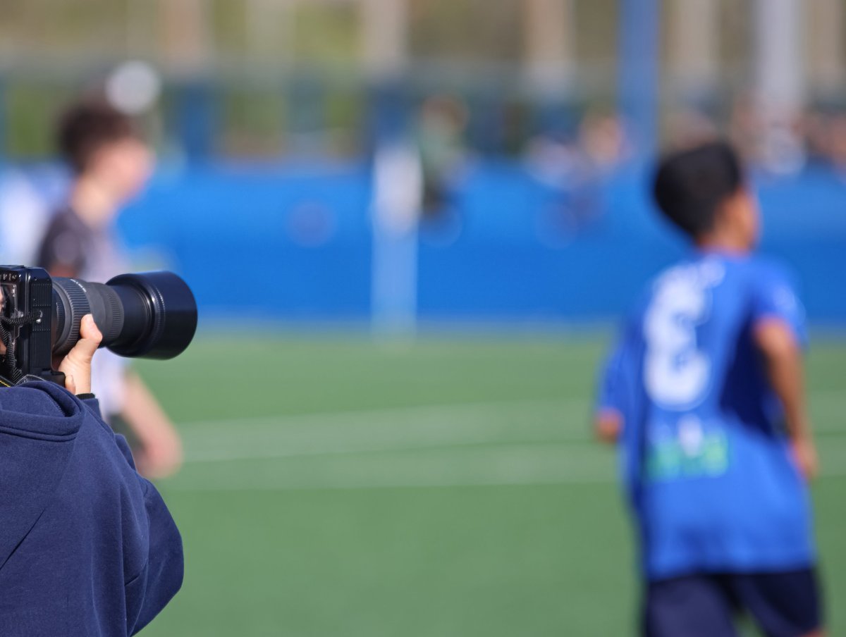 Photographer at a football field